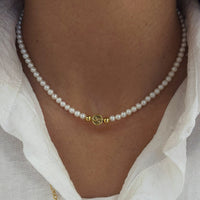 SYMBOLISM PEARL NECKLACE