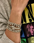 d-by-dalia-jewelry multi-layered silver-tone chain bracelet with knotted detail and mixed textures on a wrist