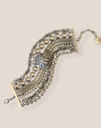 d-by-dalia-jewelry multi-layered silver-tone chain bracelet with beaded strands, snake chain, and knotted detail.