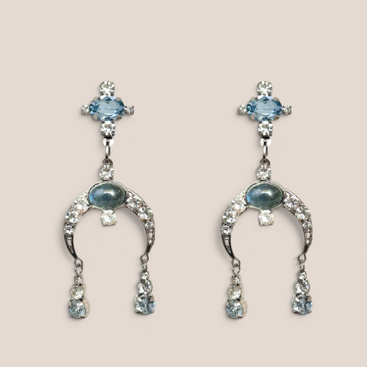 D by Dalia Jewelry silver-tone chandelier drop earrings with icy blue crystals and crescent-shaped pavé accents.