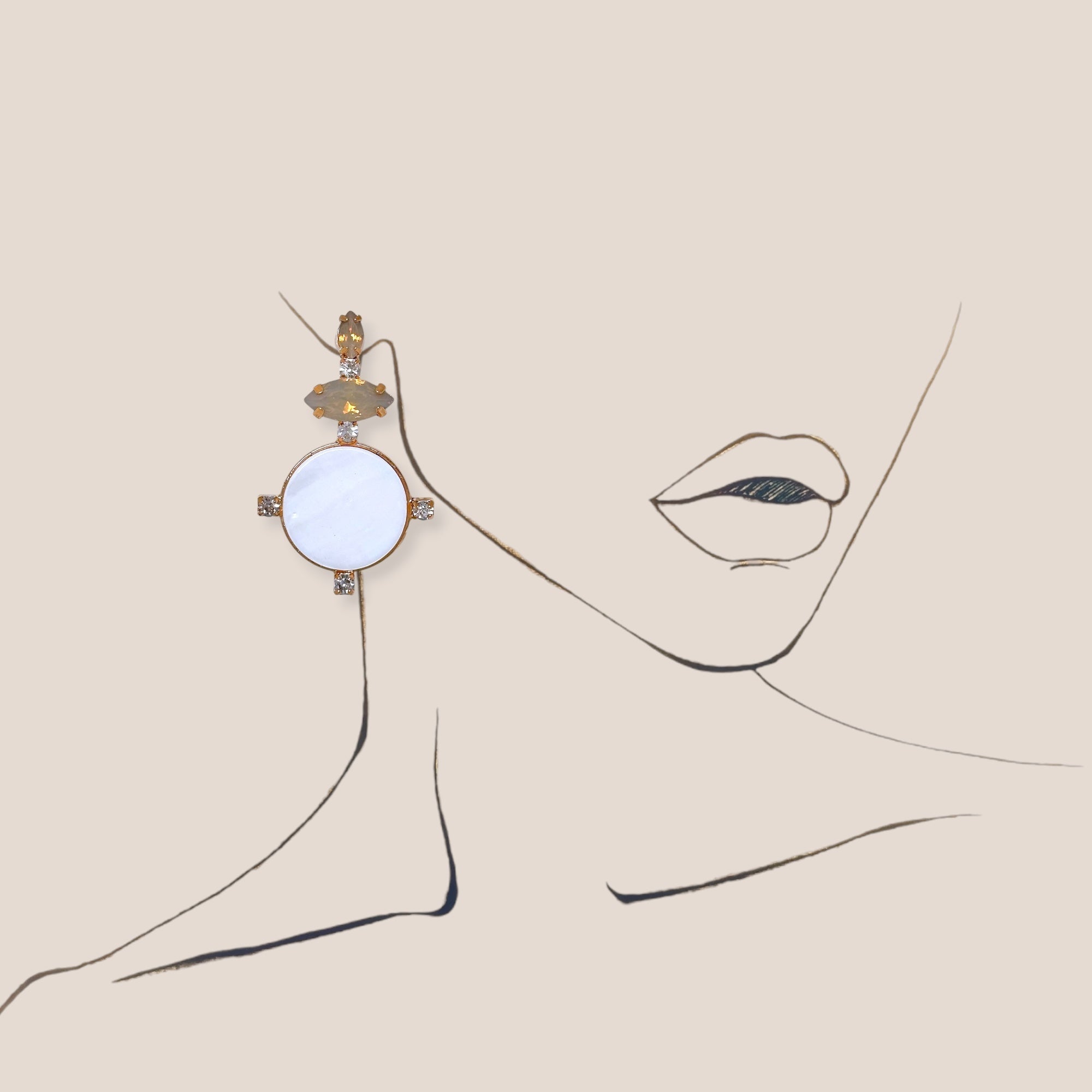 d-by-dalia-jewelry circular drop earrings with white discs, neutral faceted stones, and gold-tone crystal accents.