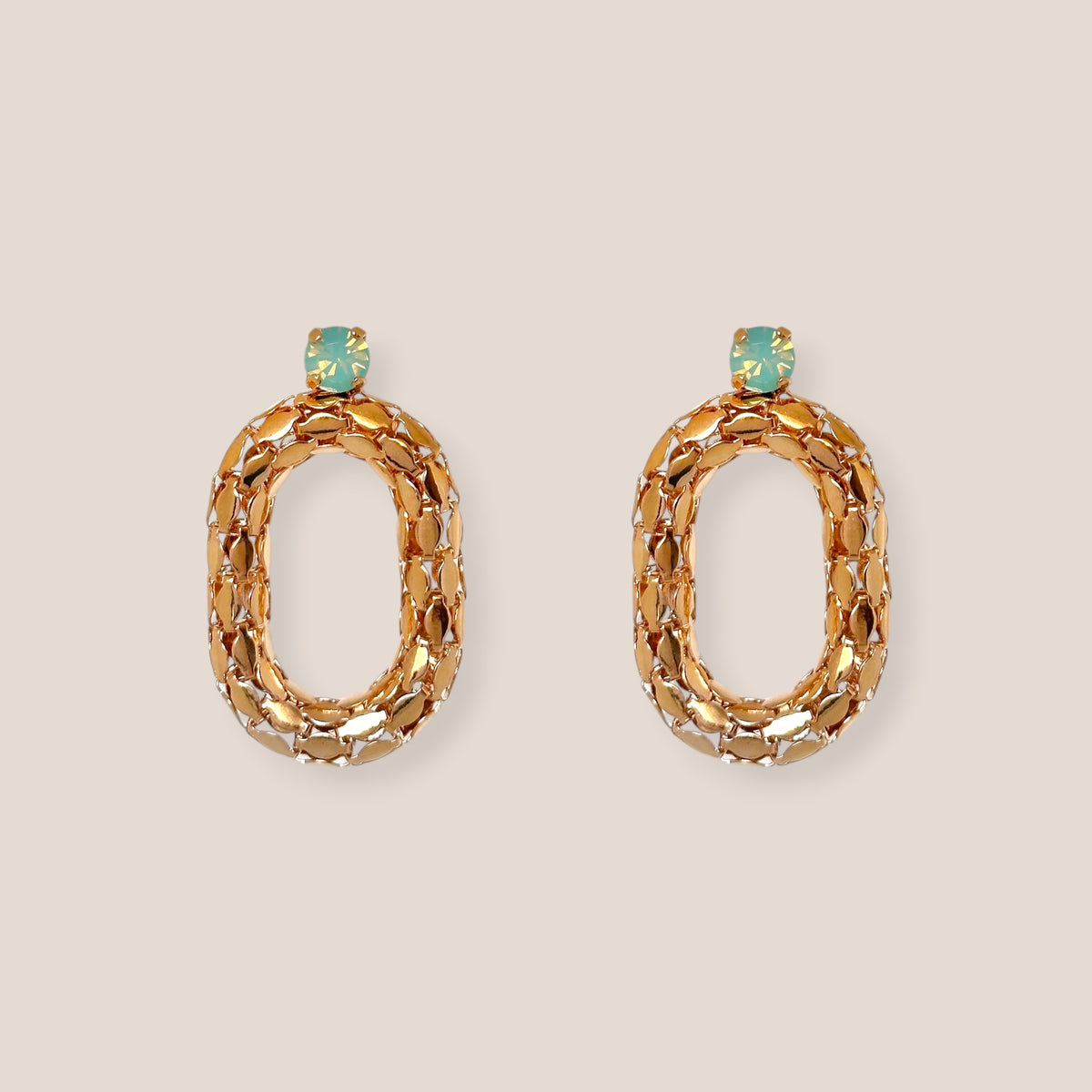 d-by-dalia-jewelry gold-tone textured oval hoop earrings with turquoise crystal accents for a sophisticated look.
