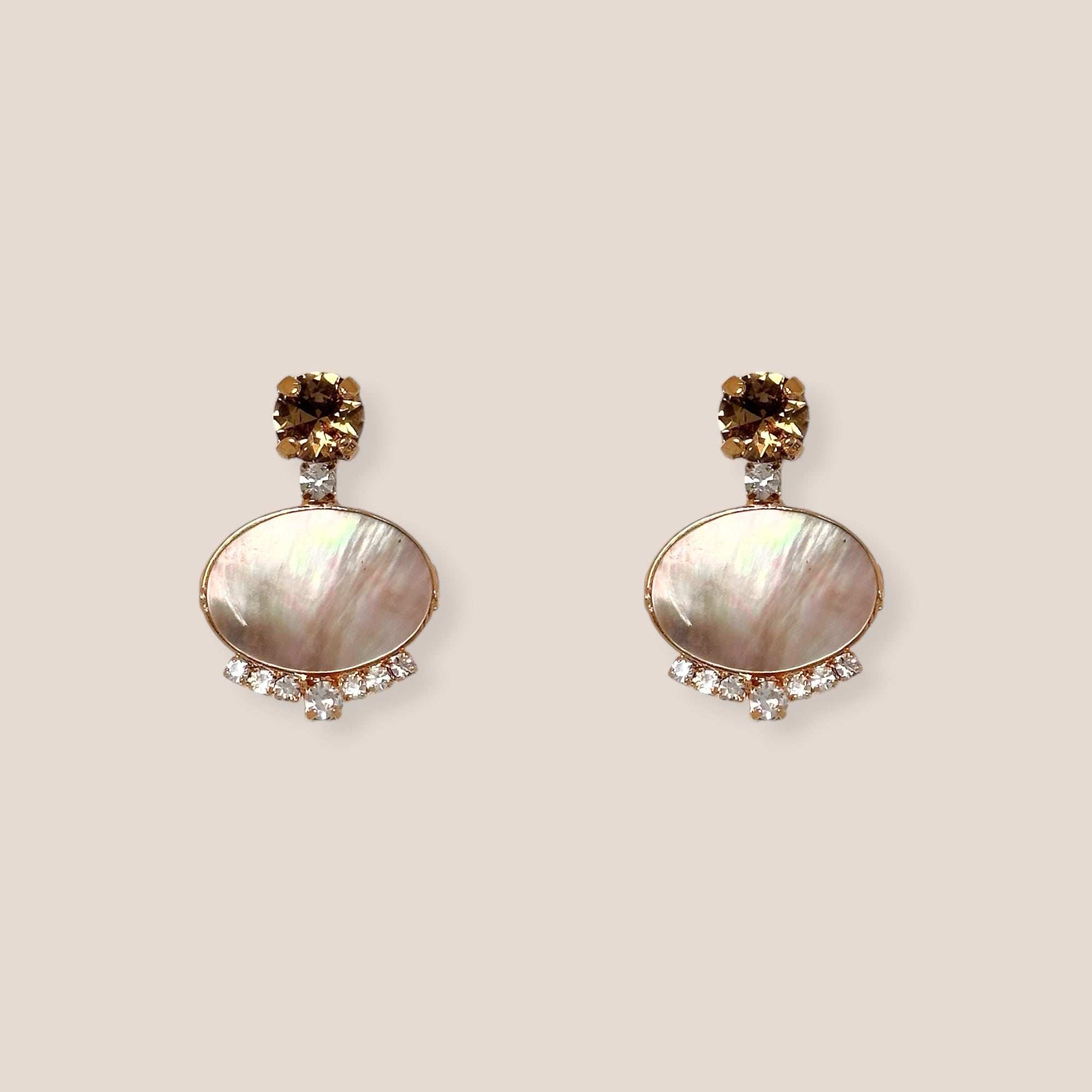 d-by-dalia-jewelry oval drop earrings with iridescent mother-of-pearl, champagne crystals, and gold-toned settings.